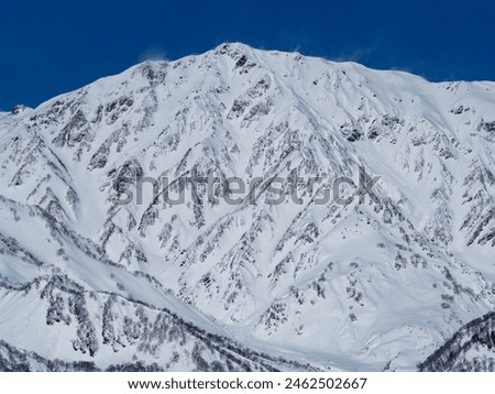 Northern Alps and clear skies in midwinter, Hakuba Village, Nagano Prefecture Royalty-Free Stock Photo #2462502667
