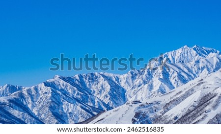 Happo One Ski Resort and the Northern Alps in Midwinter, Hakuba Village, Nagano Prefecture Royalty-Free Stock Photo #2462516835
