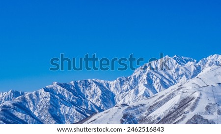 Happo One Ski Resort and the Northern Alps in Midwinter, Hakuba Village, Nagano Prefecture Royalty-Free Stock Photo #2462516843