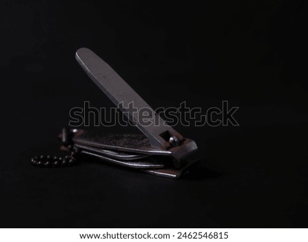 old nail clippers on a black background