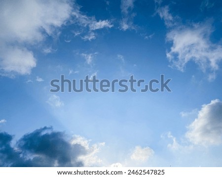 Scenery of a blue sky with white and gray fluffy clouds. The atmosphere before it rains or after it rains is a wonderful picture worth searching for, about sorrow and loneliness.