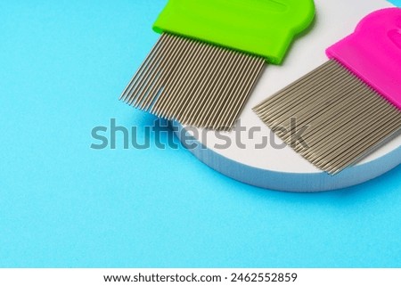 Comb for lice removing on blue background