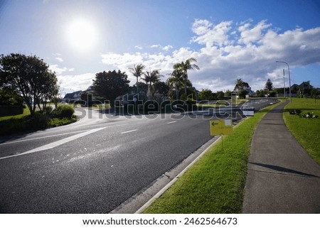 Intersection of country roads with real estate agencies signs, Whangaparaoa