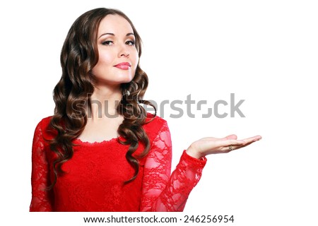 Happy smiling beautiful young woman showing copyspace or something, isolated over white background