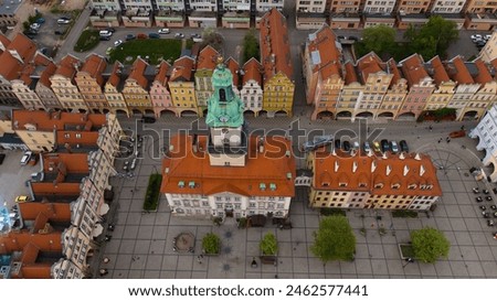 Aerial perspective highlights the architectural beauty of Jelenia Góra's market square and the historic significance of the 18th-century town hall in the heart of the city.




