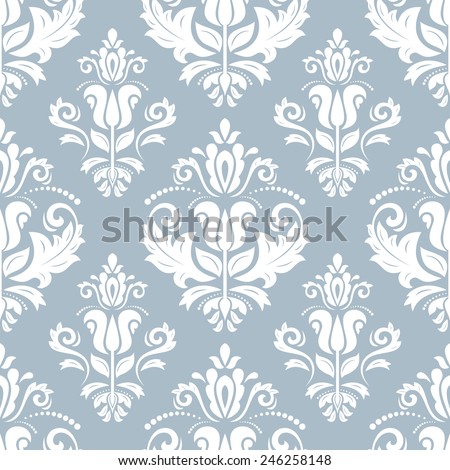 Damask  floral pattern with arabesque and oriental elements. Seamless abstract traditional ornament for wallpapers and background. Blue and white colors