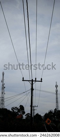 Twin towers with electricity poles beside streets