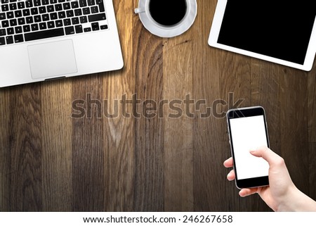 smartphone, digital tablet pc, computer and cup of coffee on wooden table