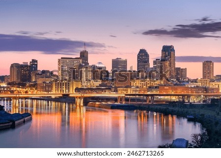 Saint Paul, Minnesota, USA downtown skyline on the Mississippi River at dusk.