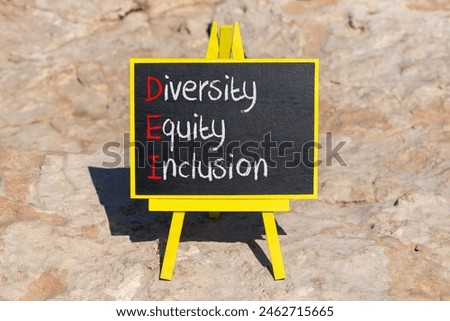 DEI diversity equity and inclusion symbol. Concept words DEI diversity equity inclusion on blackboard. Beautiful stone background. Business DEI diversity equity and inclusion concept. Copy space.
