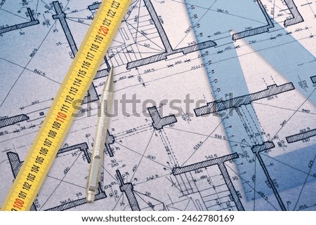 Architectural drawing with relief of the planimetry of an old building with plastic set square and meter