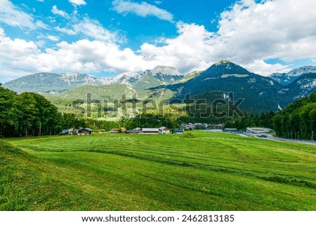 Landscape view to the Bavarian village Schönau am Königssee. lake Koenigssee, Berchtesgaden National Park, Bavaria, Germany. view to the Alps, to Mountains: Hinterer Brandkopf, Jenner and Rabenwand Royalty-Free Stock Photo #2462813185