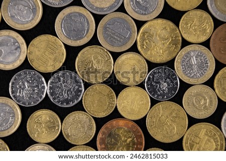 Collection of coins from different countries and times, top view