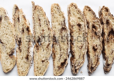 Overhead view of sliced date jam filled bread, flatlay of date filled bread slices Royalty-Free Stock Photo #2462869887