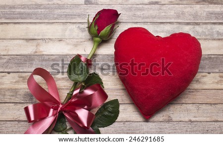 Valentine's Day. Red rose and heart on a white background