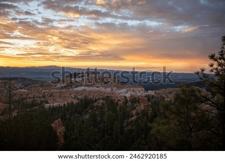 Bryce Canyon, sunrise, Utah, hoodoos, national park, morning light, golden hour, breathtaking, landscape, dramatic, rock formations, vibrant colors, sky, red rocks, shadows, natural wonder, amazing