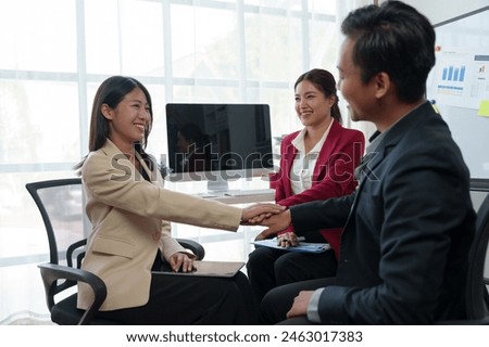 Business team congratulates on success Businessman presents marketing plan Receive praise from your team mates. Clap your hands in congratulations in the conference room. Success concept. Royalty-Free Stock Photo #2463017383