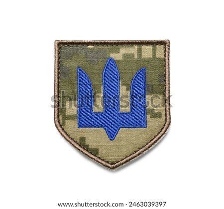 Military badge of Ukrainian army with trident isolated on white background