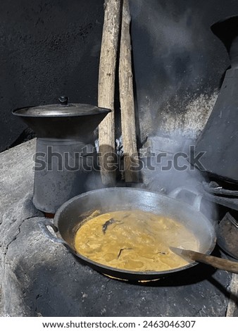 Hawu is a traditional cookware with firewood. Royalty-Free Stock Photo #2463046307