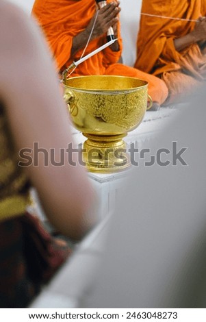 close up golden holy water bowl, thai culture and traditional wallpaper background concept