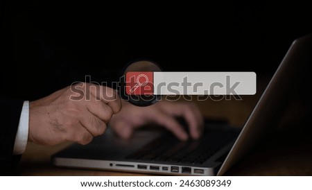Businessman uses magnifying glass pointing at screen, Searching work on the internet concept,Technology Search Engine Optimization,Using Search Console with your website