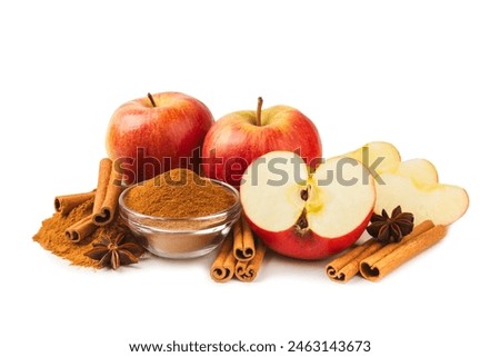 Apples with cinnamon isolated on white background. Fragrant red spiced apples with cinnamon sticks and star anise. Apple slices with spicy spices. Place for text. Harvesting. Fruits. Vegan.
