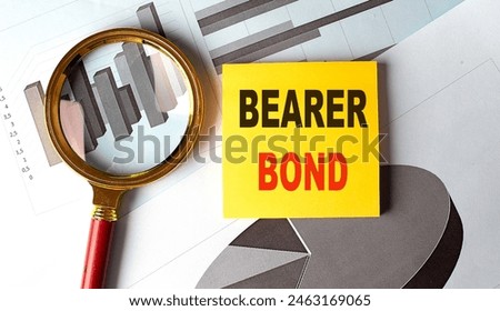 BEARER BOND text on a sticky on chart background .  Royalty-Free Stock Photo #2463169065