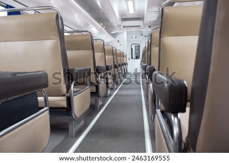 Economy class train interior. Inside of  train compartment, in Indonesia, trasportation. stock photo