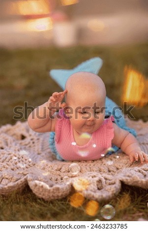 Nice little baby with mermaid tail. This photo has been taken in Prague, 2024