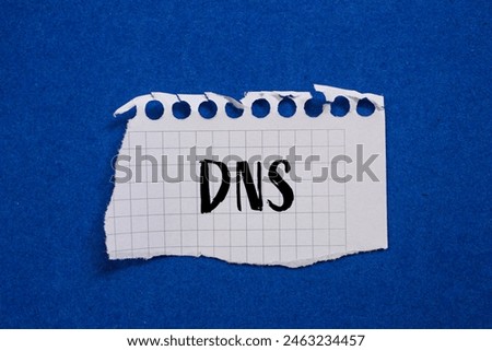 DNS word written on ripped white paper with blue background. Conceptual DNS symbol. Copy space.