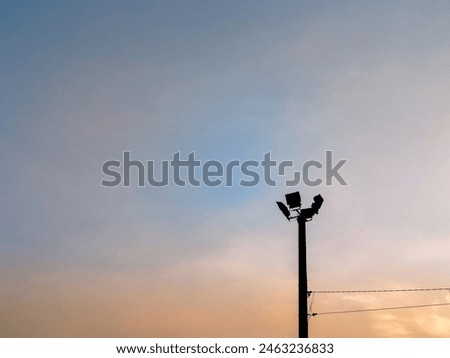 spotlight pole with sky background