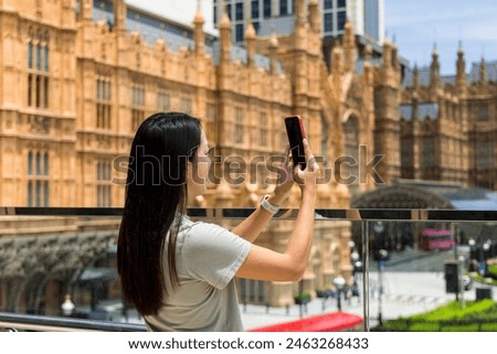Woman use cellphone to take selfie in macau city