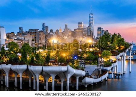 Aerial view of Lower Manhattan skyline at at dusk, behind the Little Island public park.