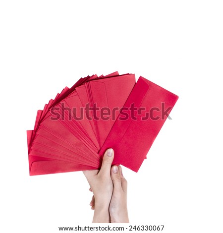 Red envelopes in the hand isolated on white background