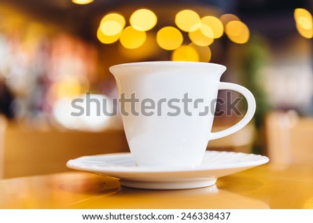 Coffee cup on wood table - vintage effect style pictures