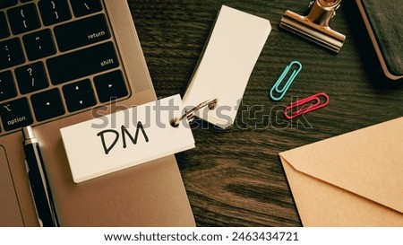 There is word card with the word DM. It is an abbreviation for Direct message as eye-catching image. Royalty-Free Stock Photo #2463434721