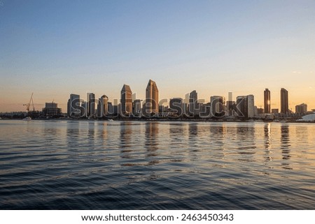 San Diego, skyline, sunrise, Coronado Bridge, Coronado Island, California, cityscape, waterfront, skyline silhouette, urban landscape, coastal, harbor, bay, morning light, dawn, golden hour, reflect