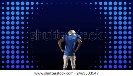 Image of rear view of american football player, over moving neon blue rings and blue circles. pro sports template concept with copy space, digitally generated image.