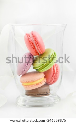 Tasty colorful macaroon. Colorful French Macarons on the white background. macaroons in glass