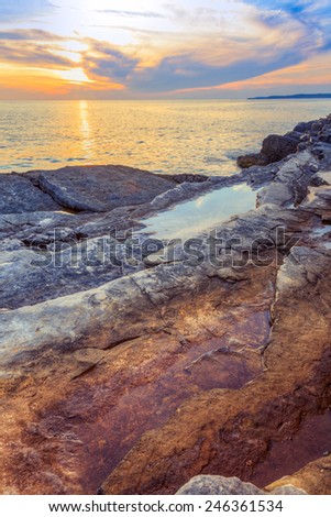 Beautiful rocks and sea. Sunrise over the sea near Rt Kamenjak, Croatia