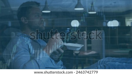 Image of financial data processing over caucasian businessman eating in office. Global business, finance, computing and data processing concept digitally generated image.