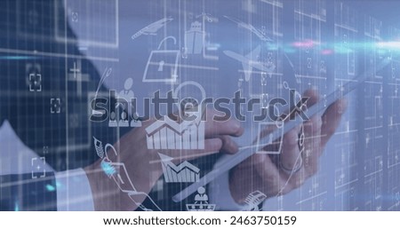 Image of icons and data processing over businessman using tablet. Global business, finance, computing and data processing concept digitally generated image.