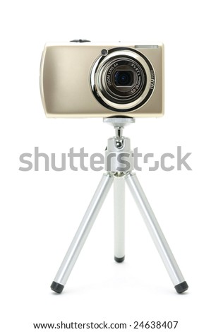 Digital camera on tripod in isolated white background