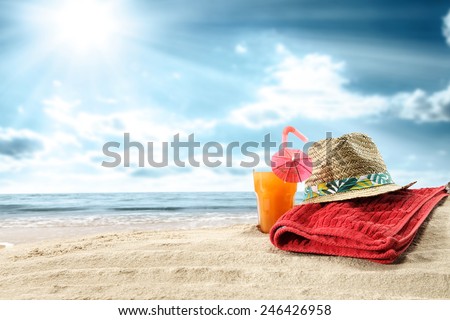 summer orange juice and towel of red  Royalty-Free Stock Photo #246426958