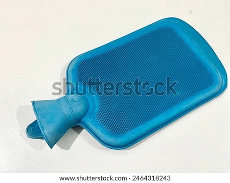 Blue hot water bag made from rubber isolated on white background