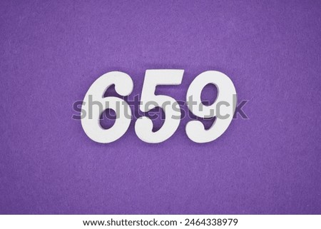 The numbers are made of white paint wood, placed on the background as a purple paper.