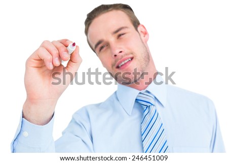 Smiling businessman in shirt writing with marker on white background