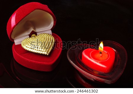 Valentines Day.Burning candle and gift.