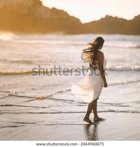 A beautiful photography of a girl is standing on a beach. 