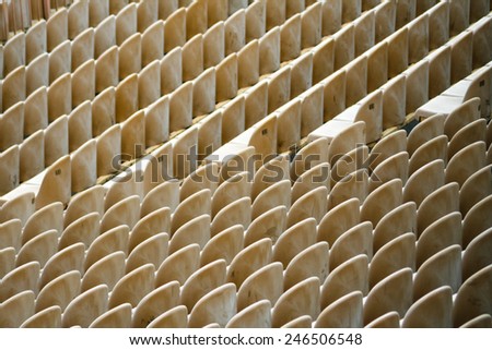 Rows of seats are empty now, but will soon be filled as spectators make their way to the event. Royalty-Free Stock Photo #246506548